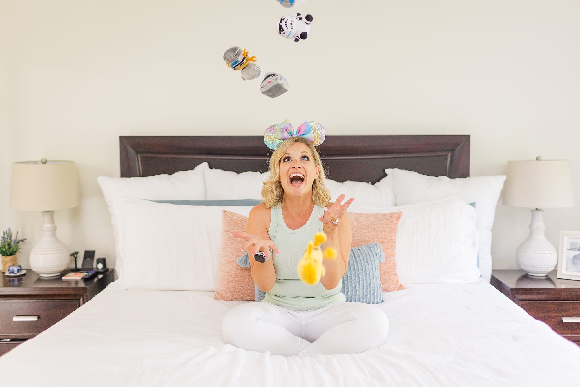woman tosses plushies in branding photos