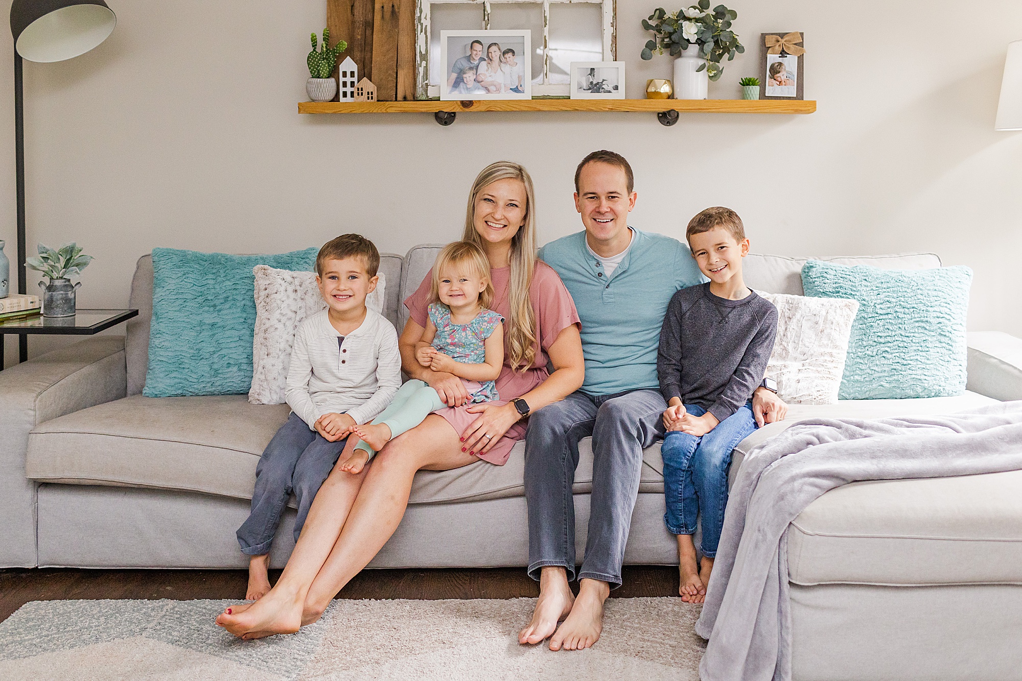 family sits together on couch during Nashville Branding Session for Family Photographer 