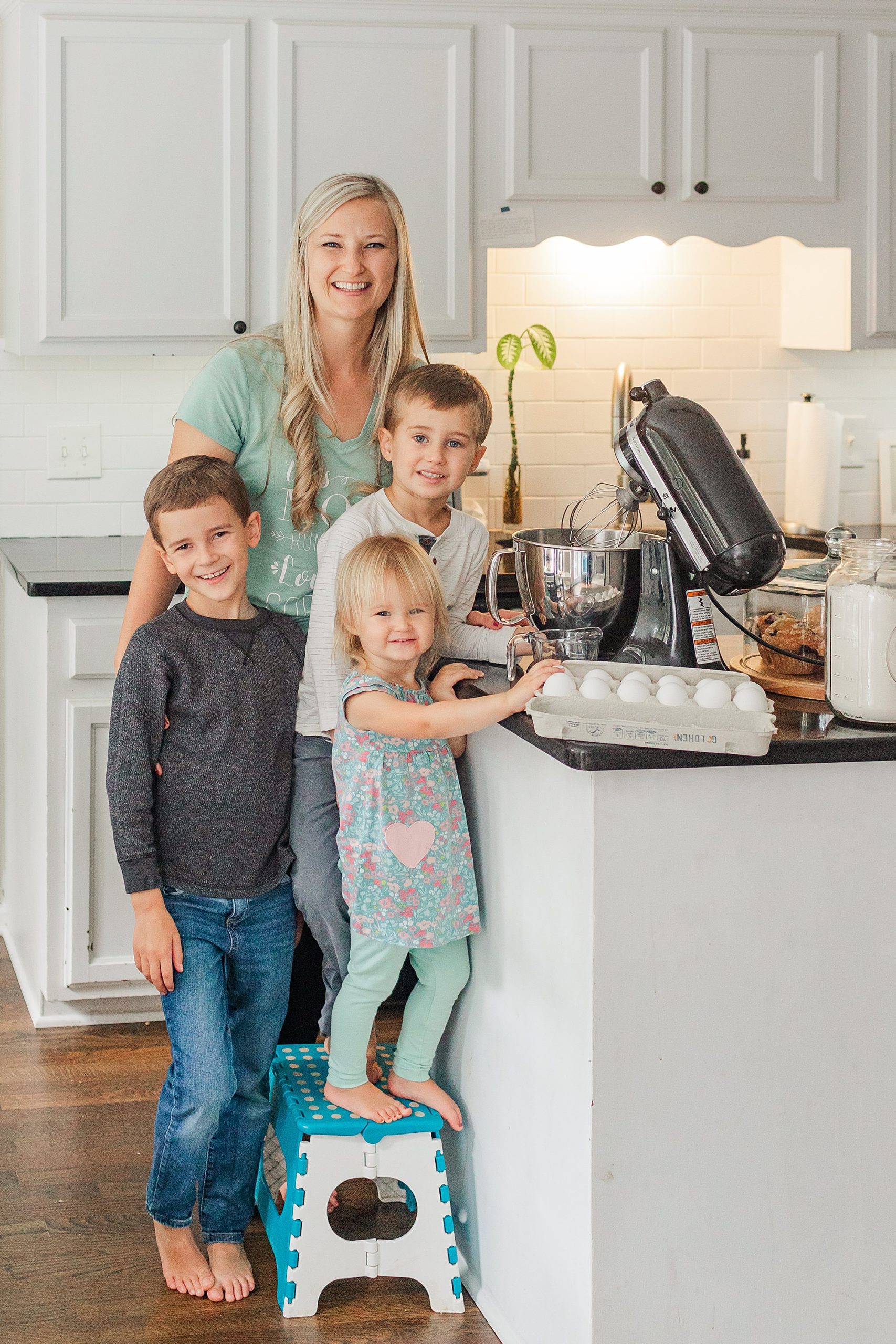 mom and kids play in kitchen during Nashville Branding Session for Family Photographer 
