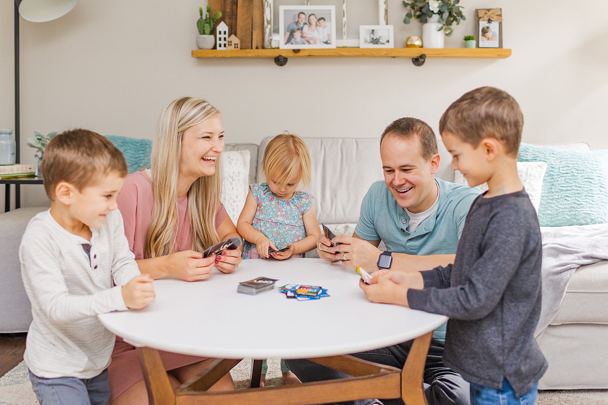 family plays card game during branding session