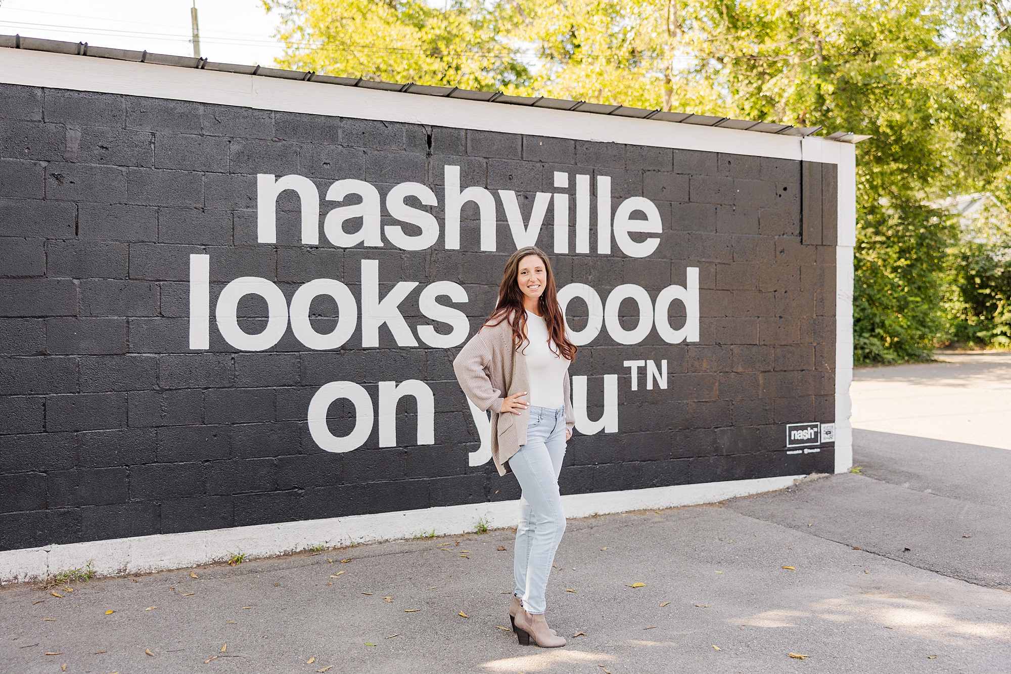 woman poses by mural in Nashville TN