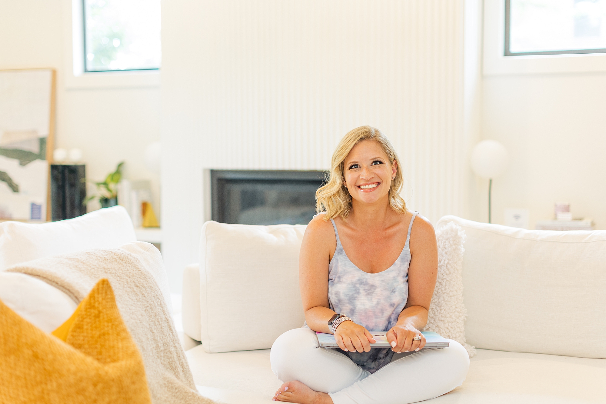 woman sits on couch during branding portraits in Nashville TN