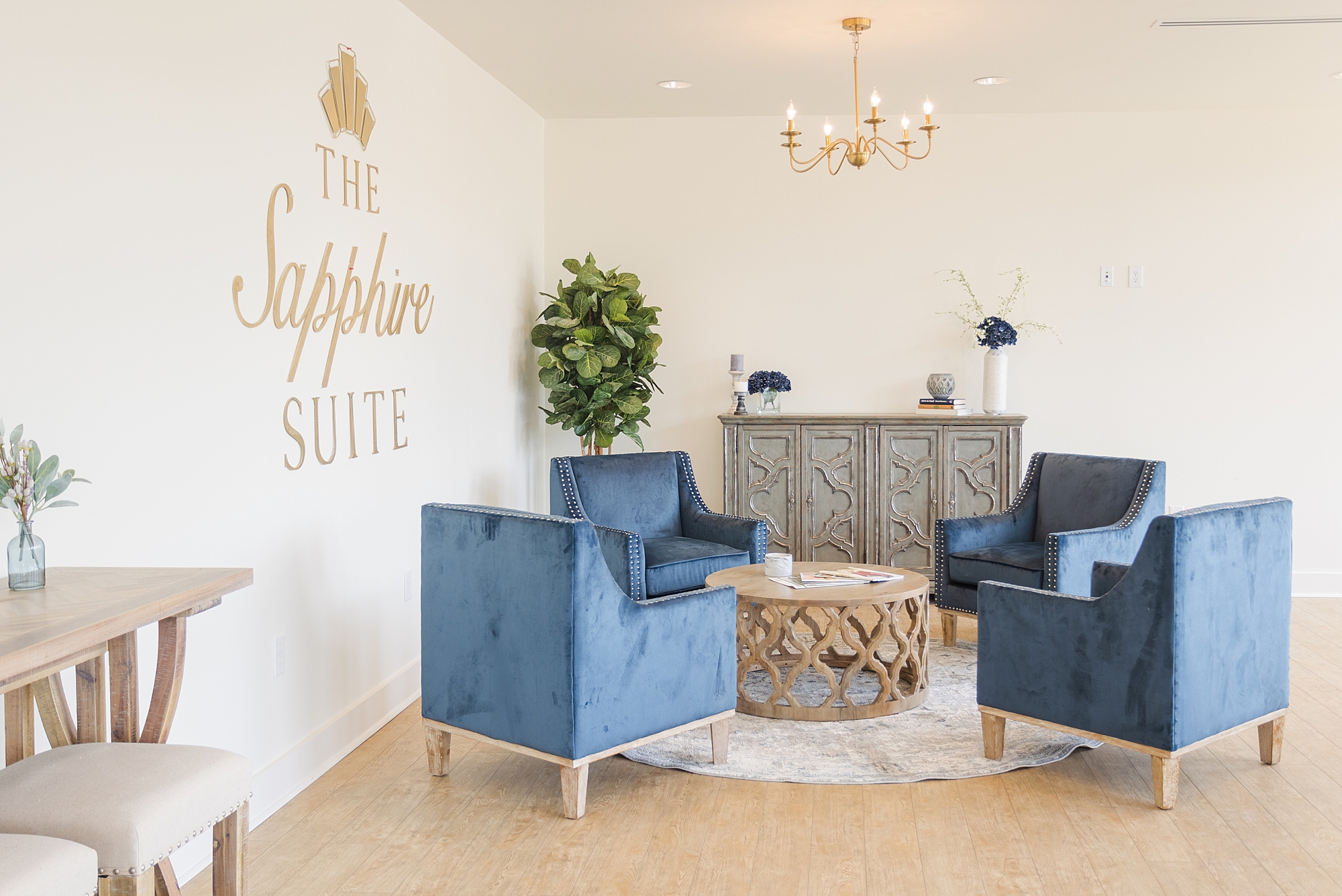 sitting room with blue and white details at The Sapphire Suite