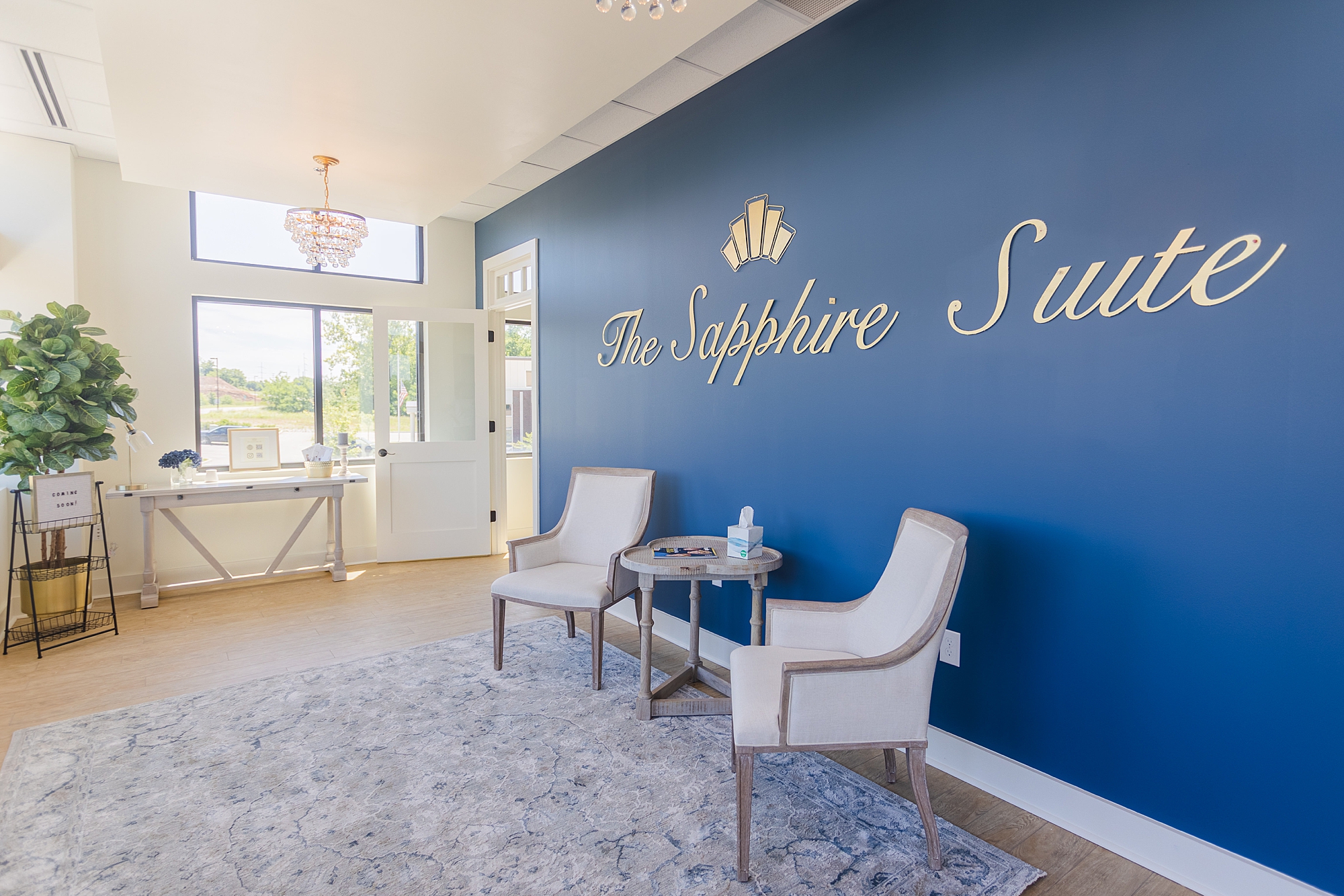 front blue wall welcoming guests to The Sapphire Suite