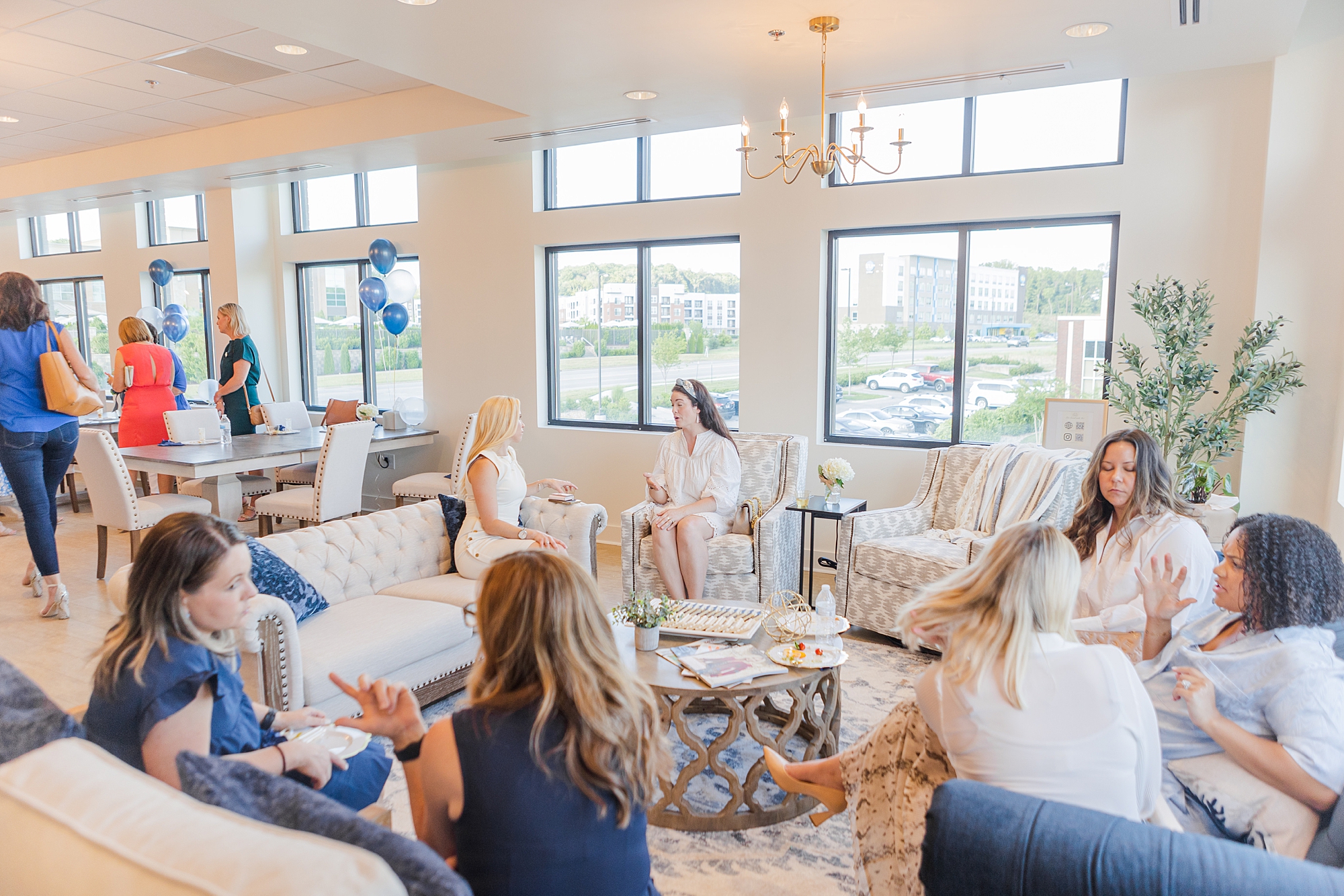 women talk sitting in The Sapphire Suite during networking event