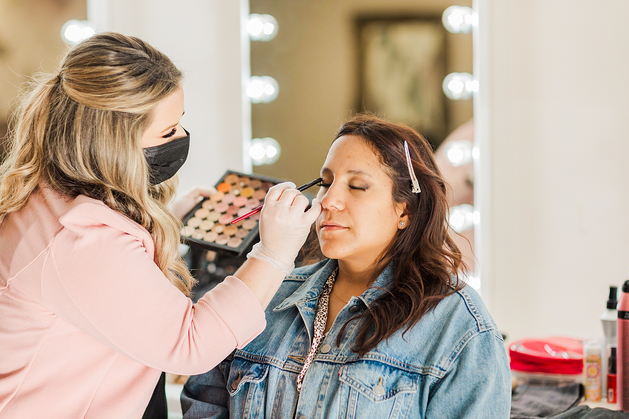 woman does makeup before branding session for business owner in Nashville