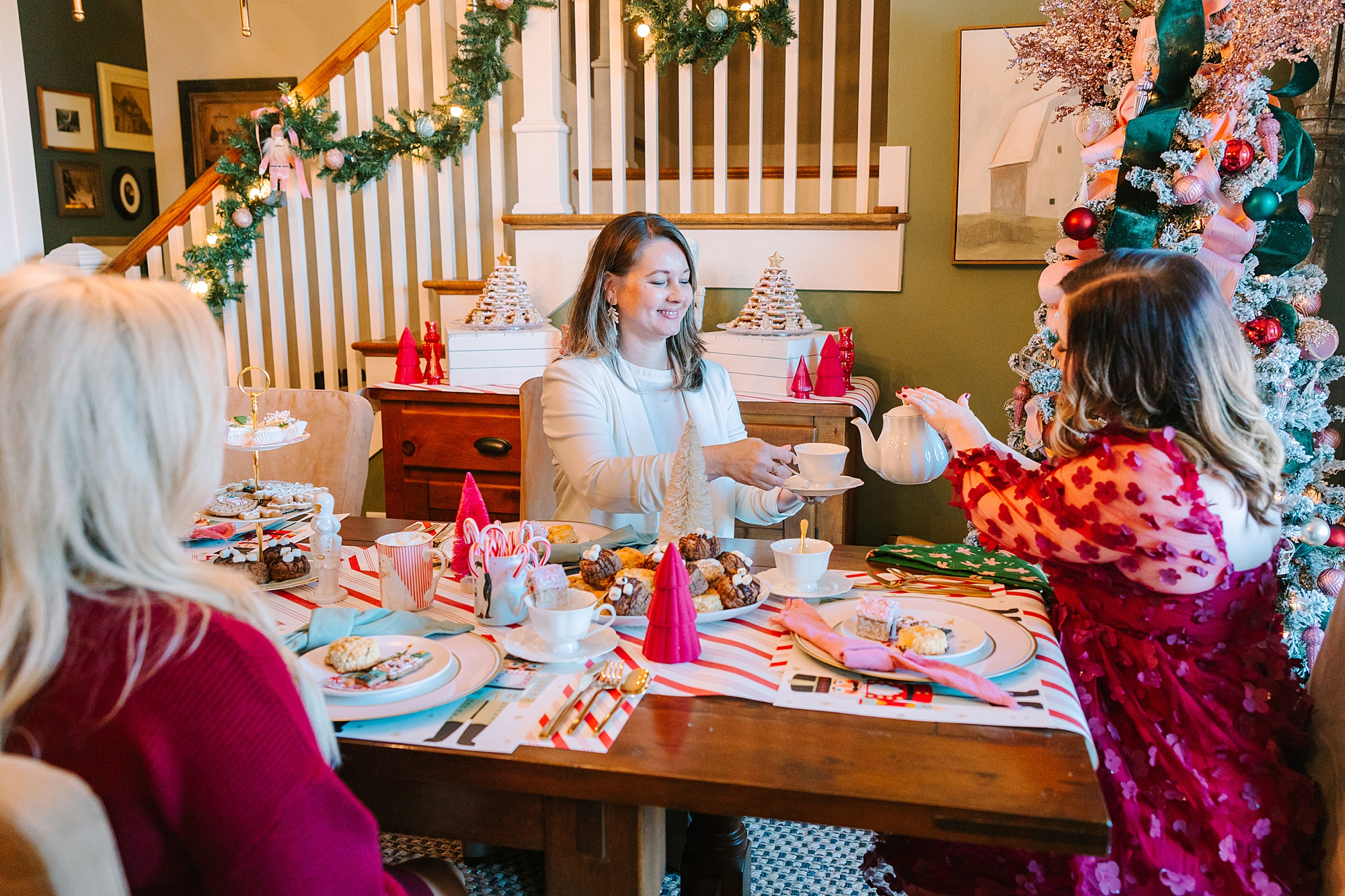 woman sit at table with daughters during Nutcracker inspired tea party with Pretty Lovely Tea