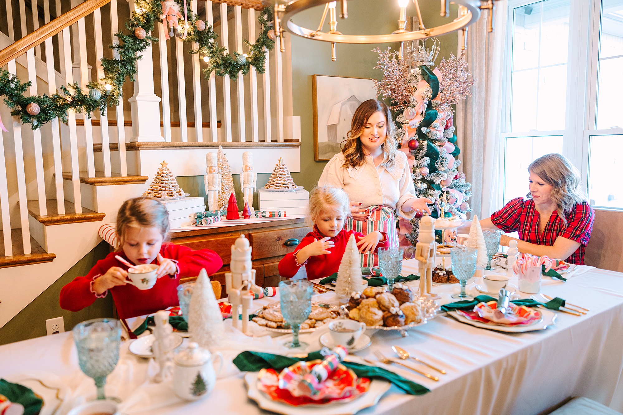 woman sits with daughters during Nutcracker inspired tea party with Pretty Lovely Tea