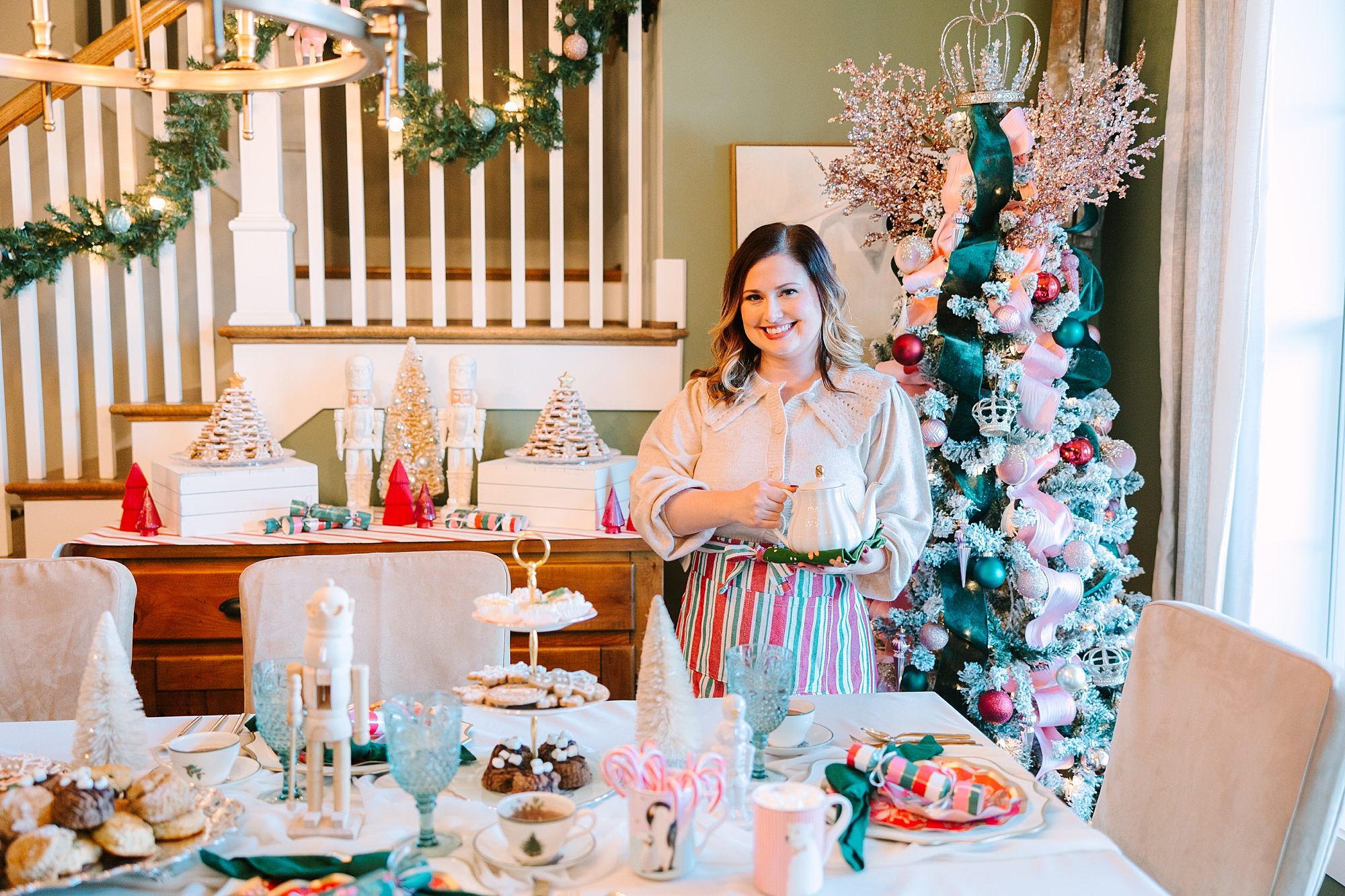 business owner poses by tablescape for Nutcracker inspired tea party with Pretty Lovely Tea