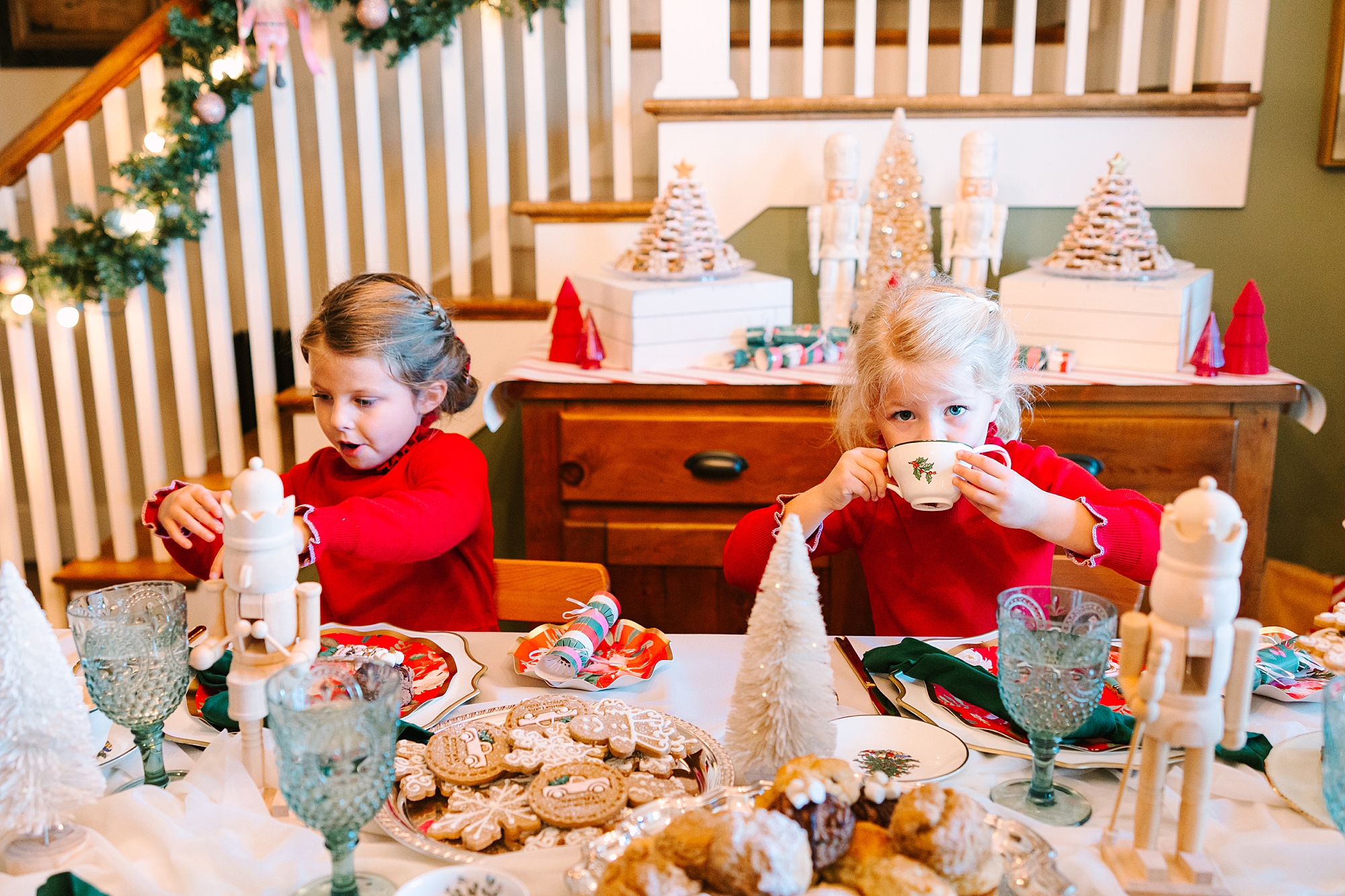 two girls play during holiday tea party