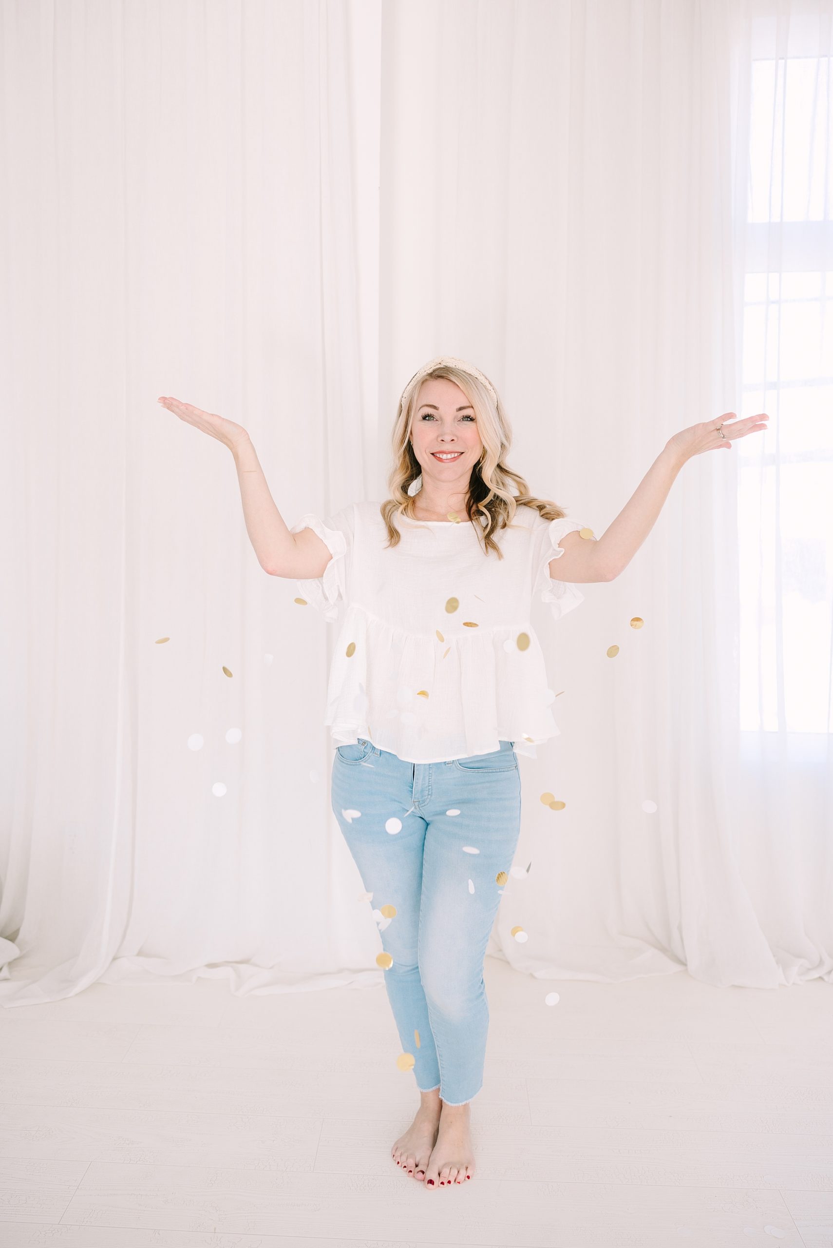 photographer tosses confetti during Studio Blanc branding photos in Nashville, TN