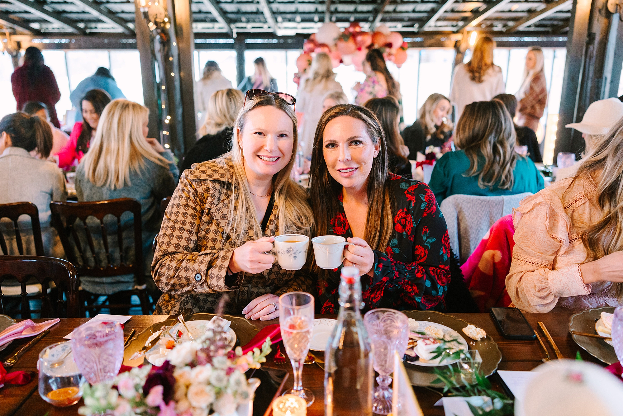 women cheers tea cups during Galentine's Day Tea Party
