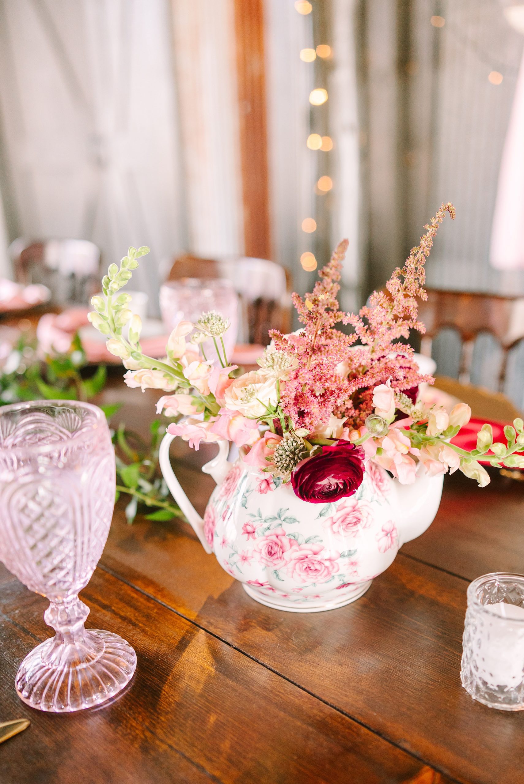 centerpieces with pink flowers inside tea pot for tea party