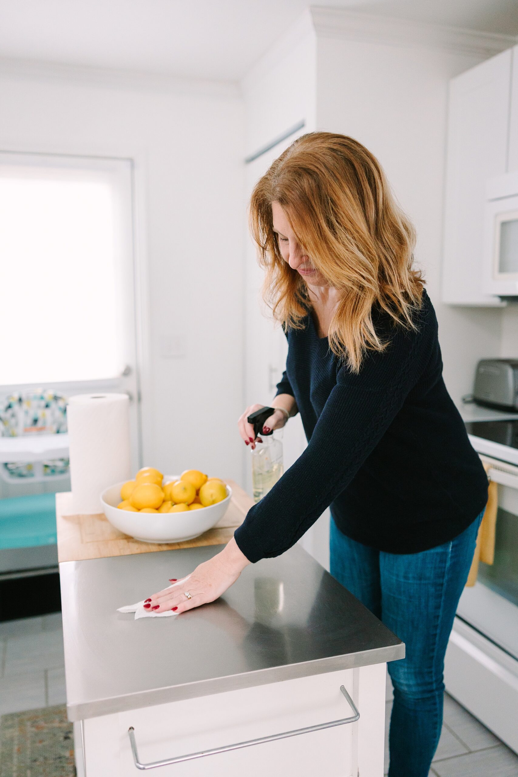 woman cleans counter during Nashville branding session
