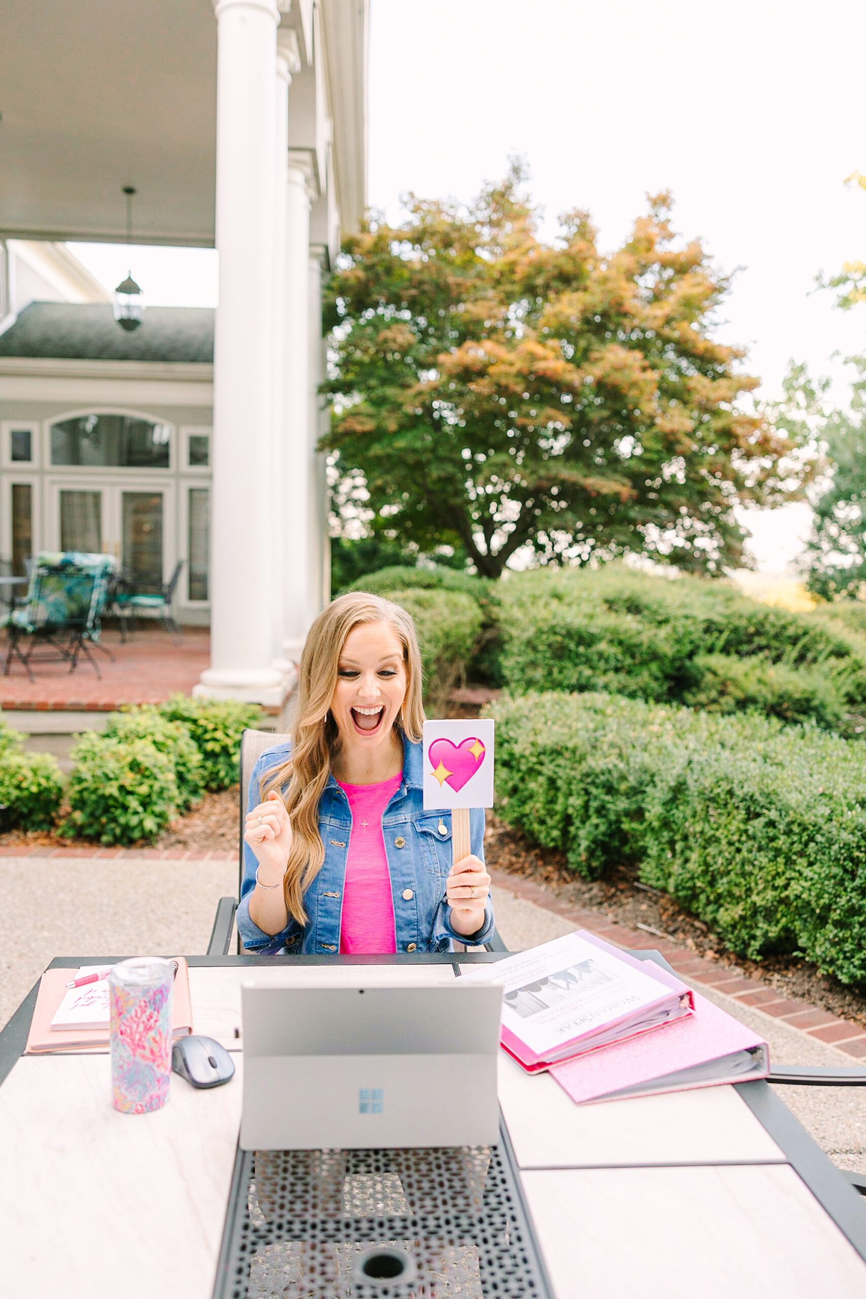 woman sits outside working during branding photos in Tennessee
