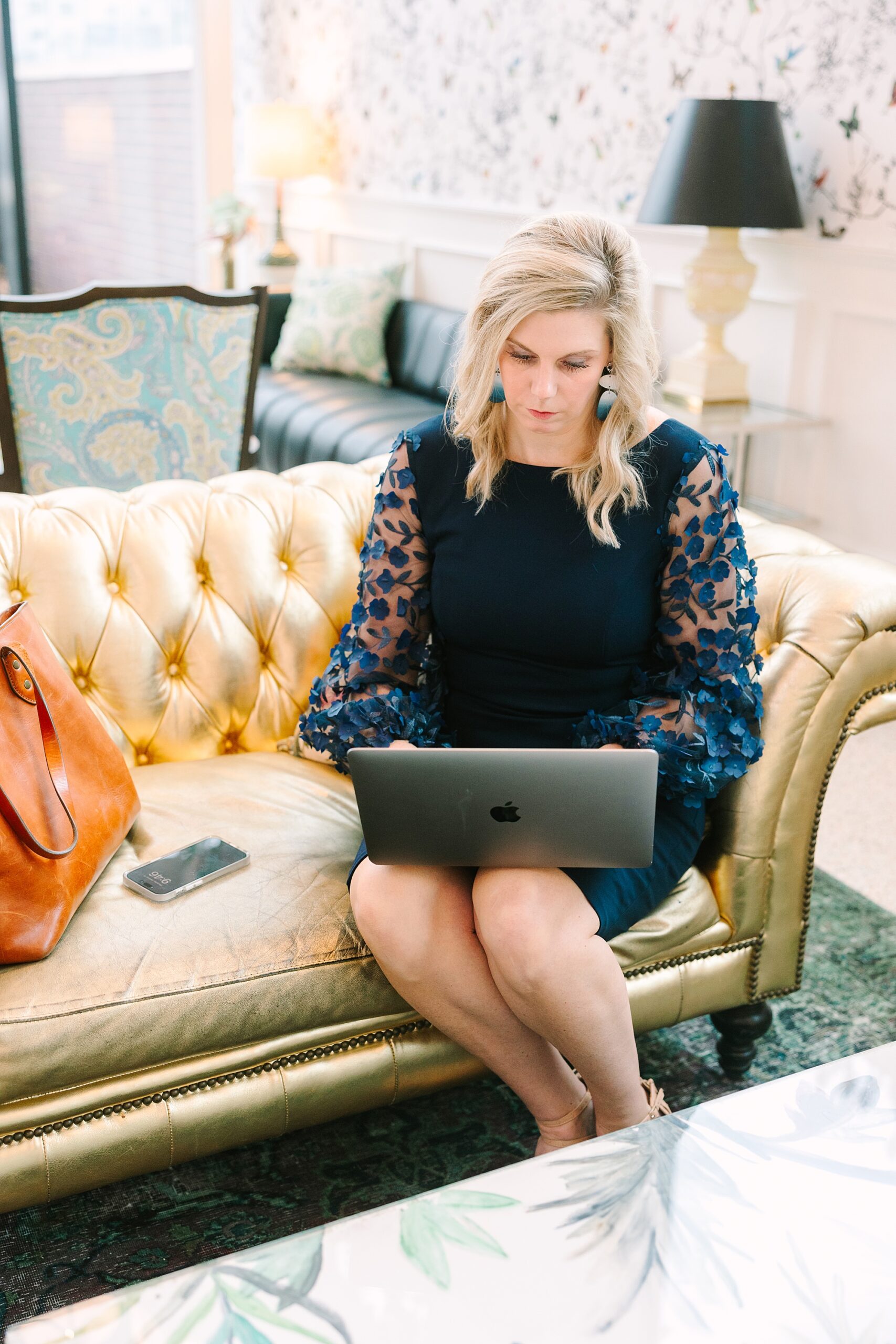 woman works on laptop during Nashville branding session