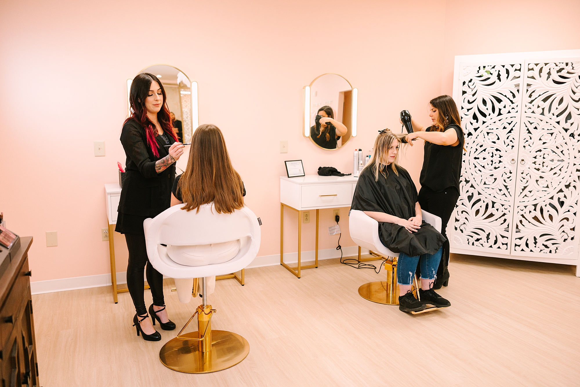 stylists work on hair inside MHD Beauty Parlor in Nashville TN
