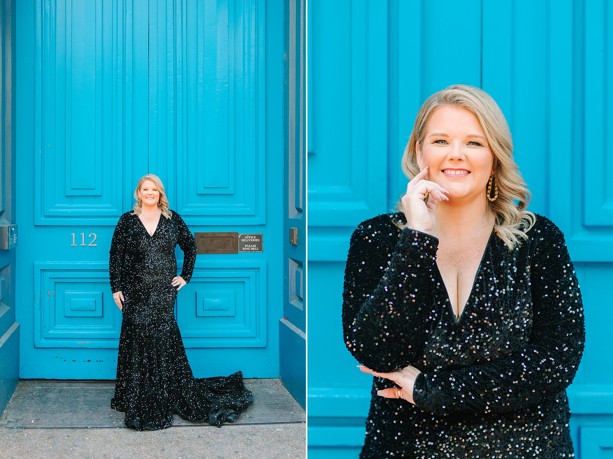 woman in black dress smiles in front of large blue doors on Broadway in Downtown Nashville