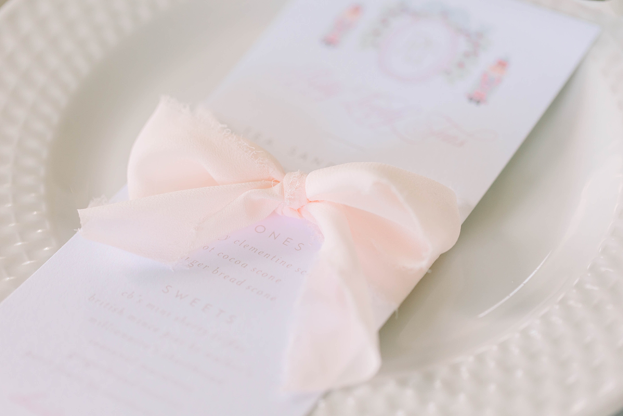 pink ribbon on menu for holiday and Nutcracker themed tea by Pretty Lovely Teas