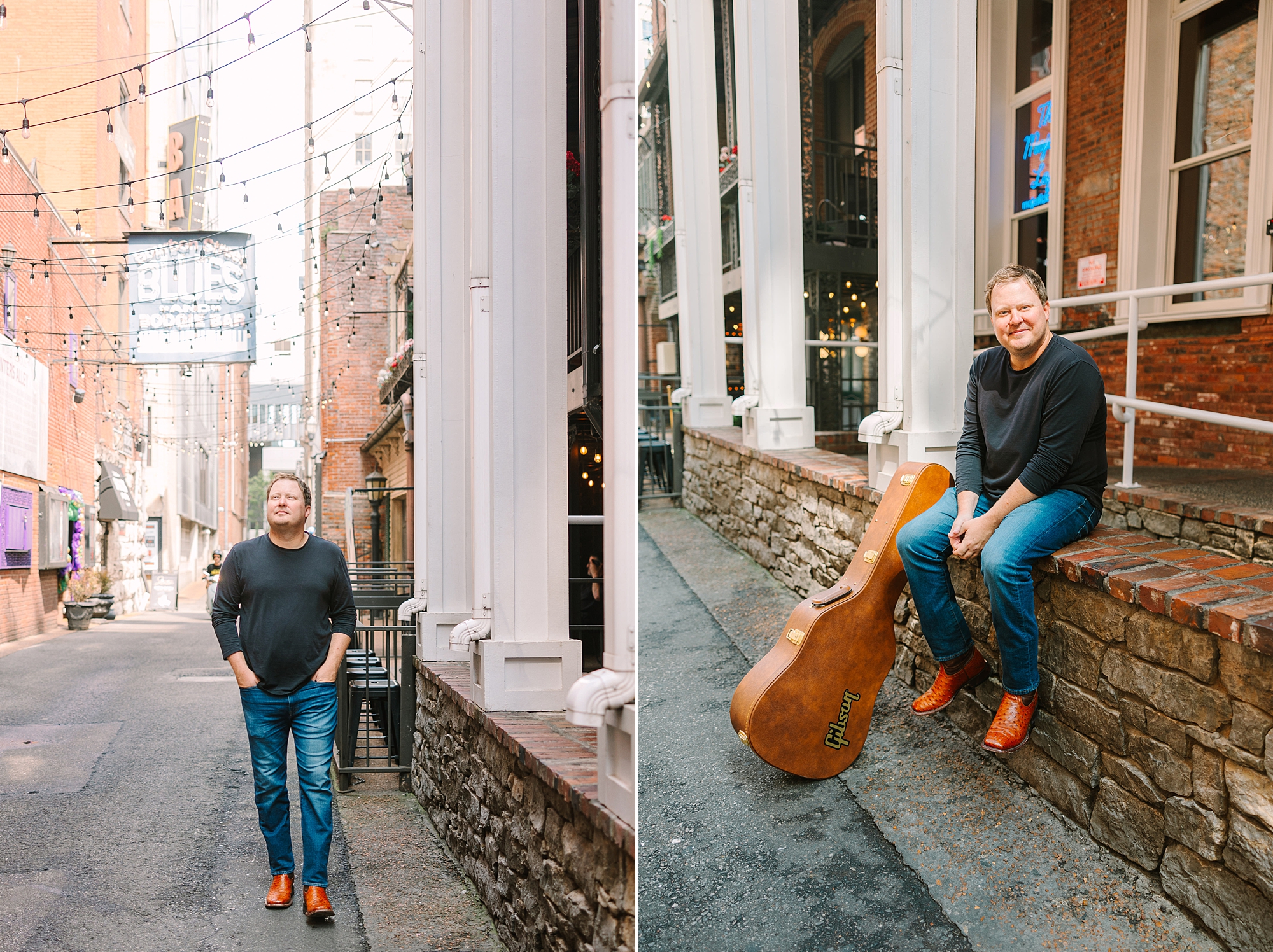 man walks down Printer's Alley and leans against wall with guitar case