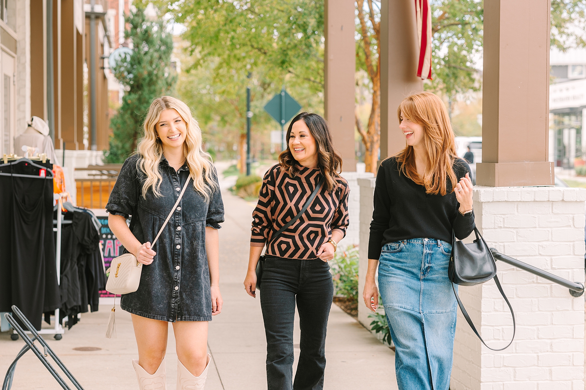 three women walk down sidewalk during quarterly Nashville branding session