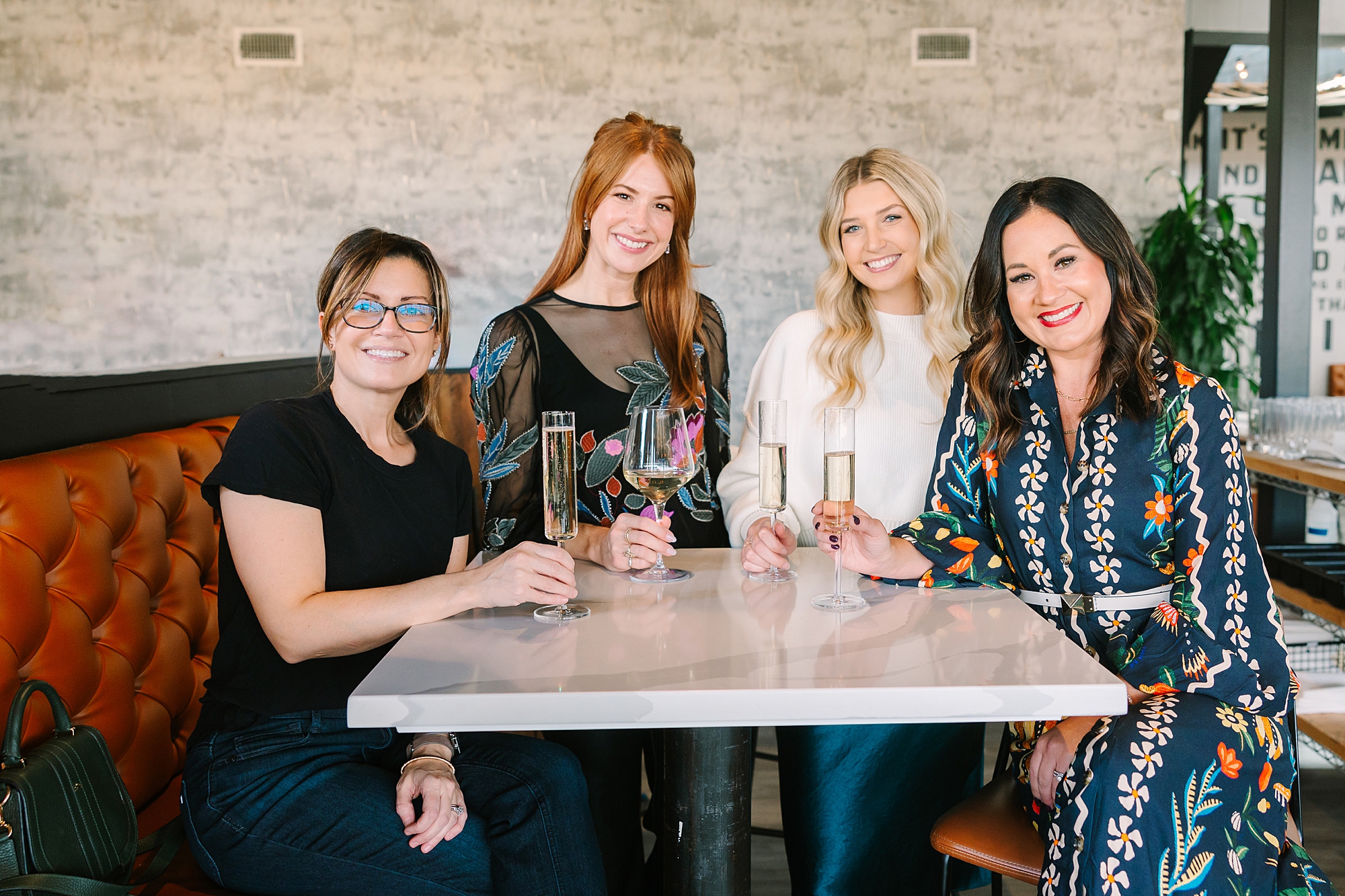 women sit around table during quarterly Nashville branding session for Be Styled Co.