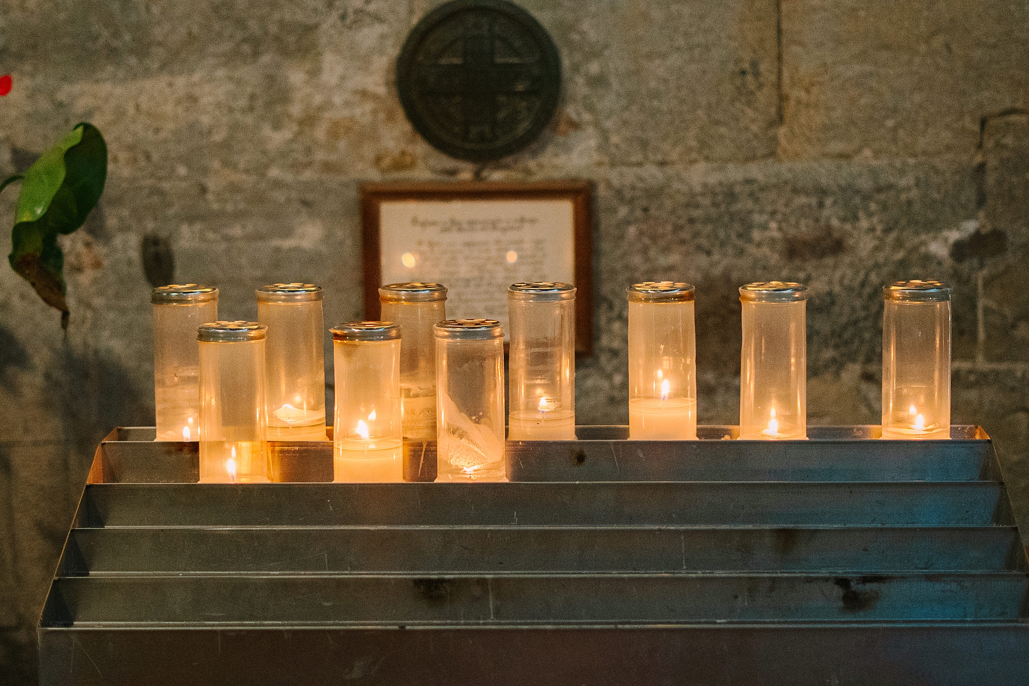candles on steps of cathedral in Italy