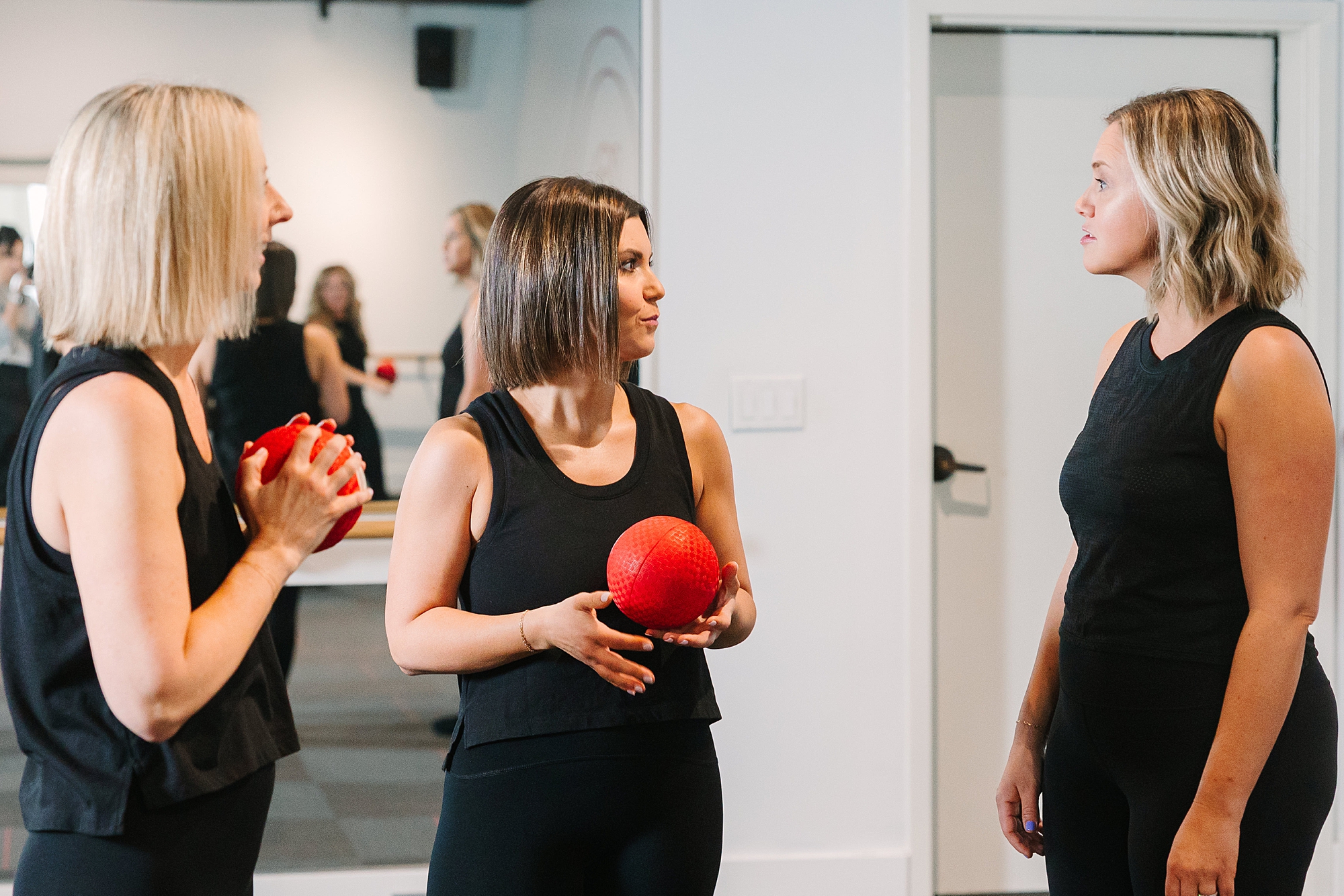 woman holds barre ball during studio class in Westhaven