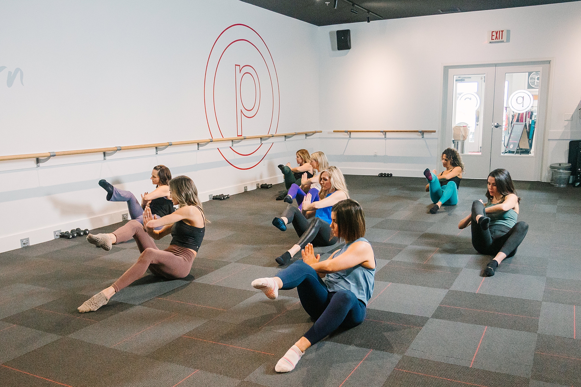 women stretch during pure barre class at Pure Barre Westhaven