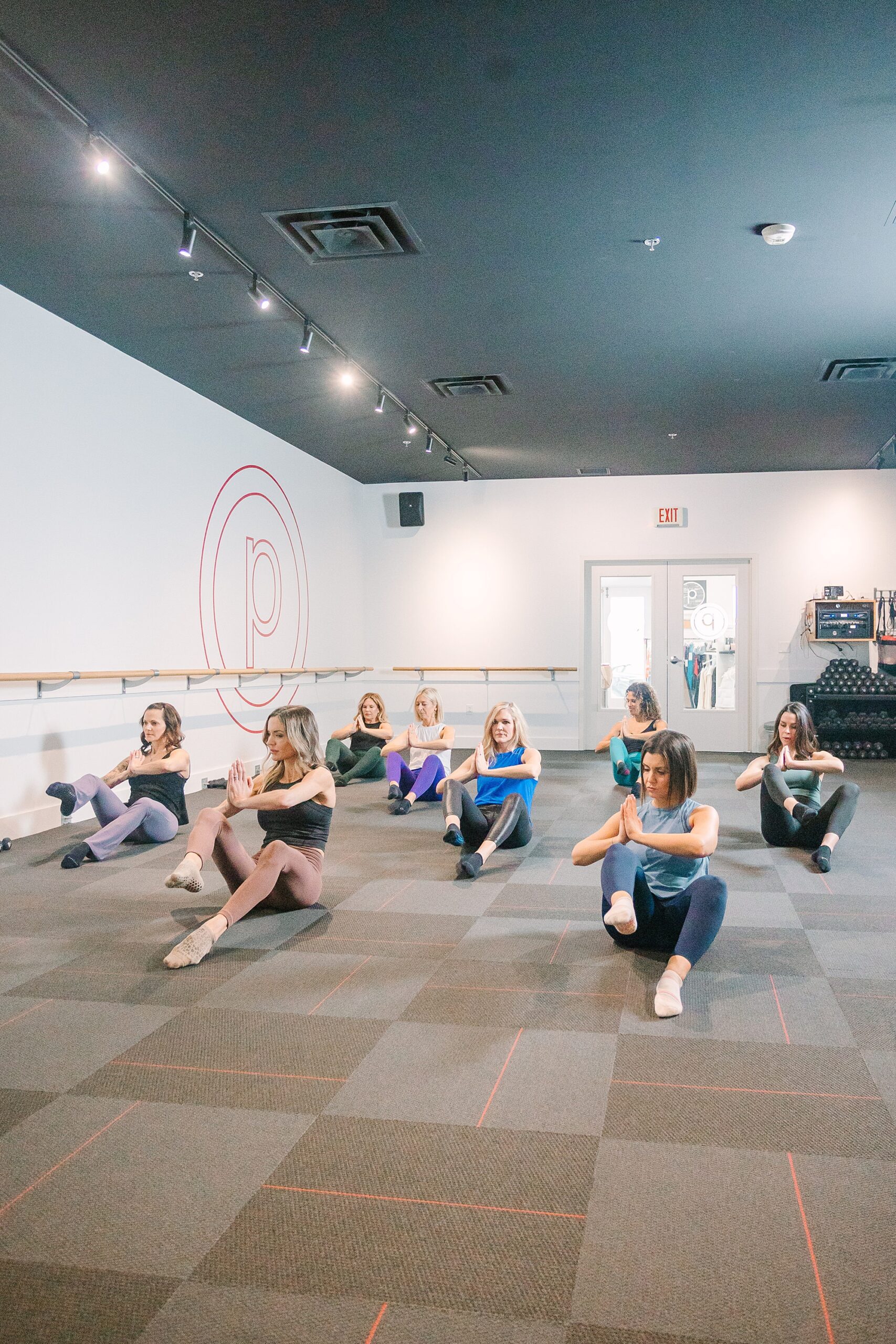 women stretch out during pure barre class in TN