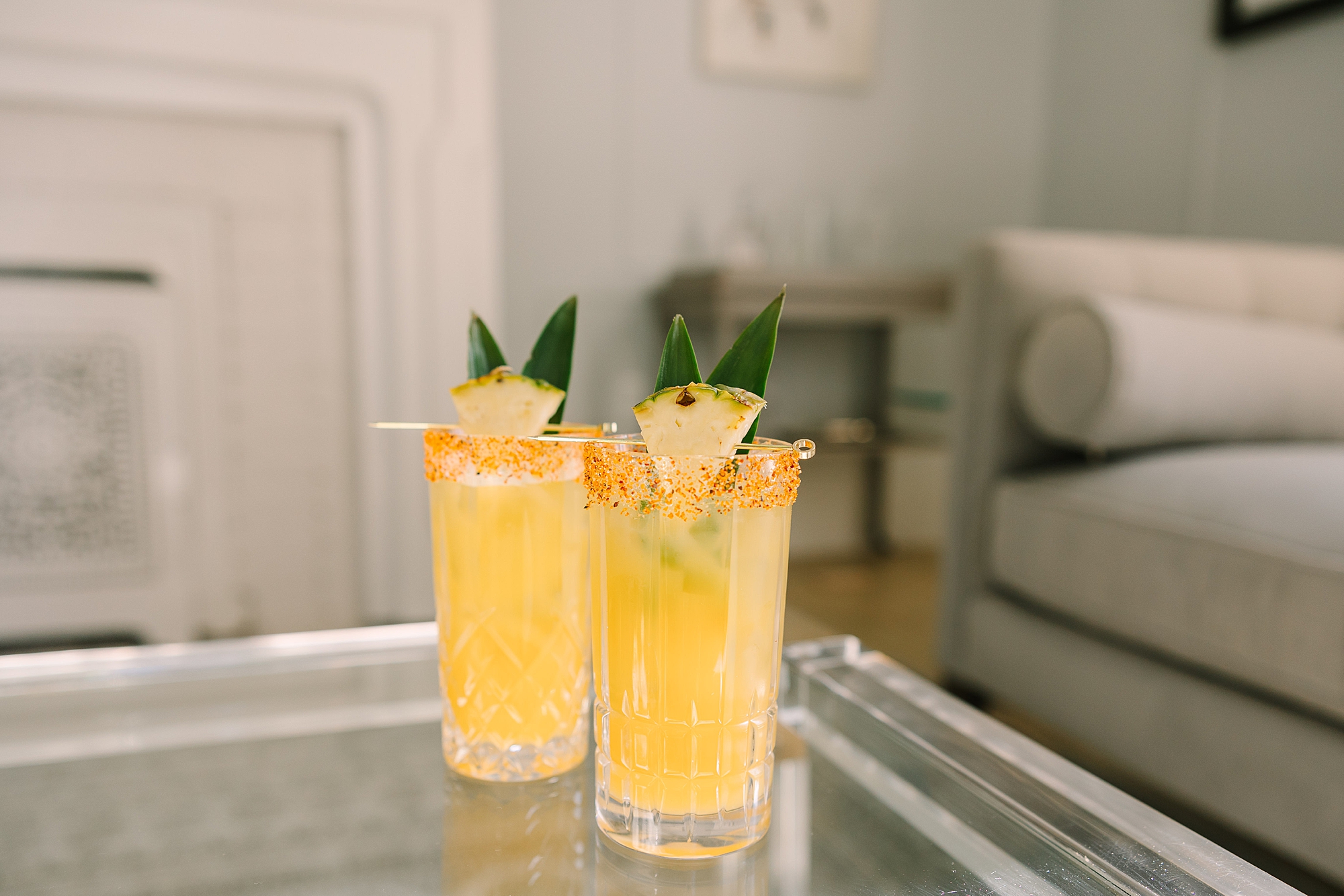 custom cocktails with pineapples across top