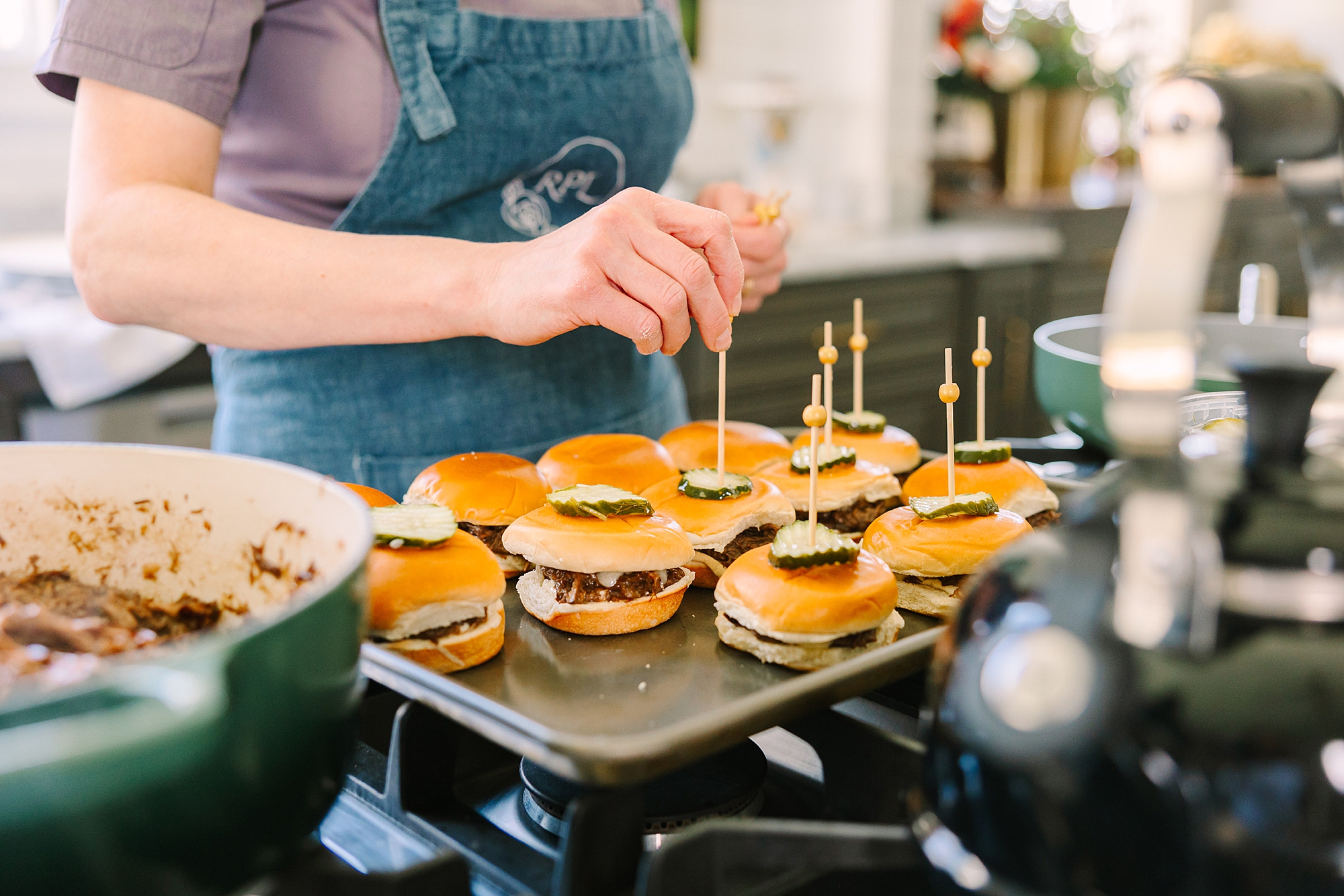 burger sliders on tray being prepared in kitchen of Magnolia Acres