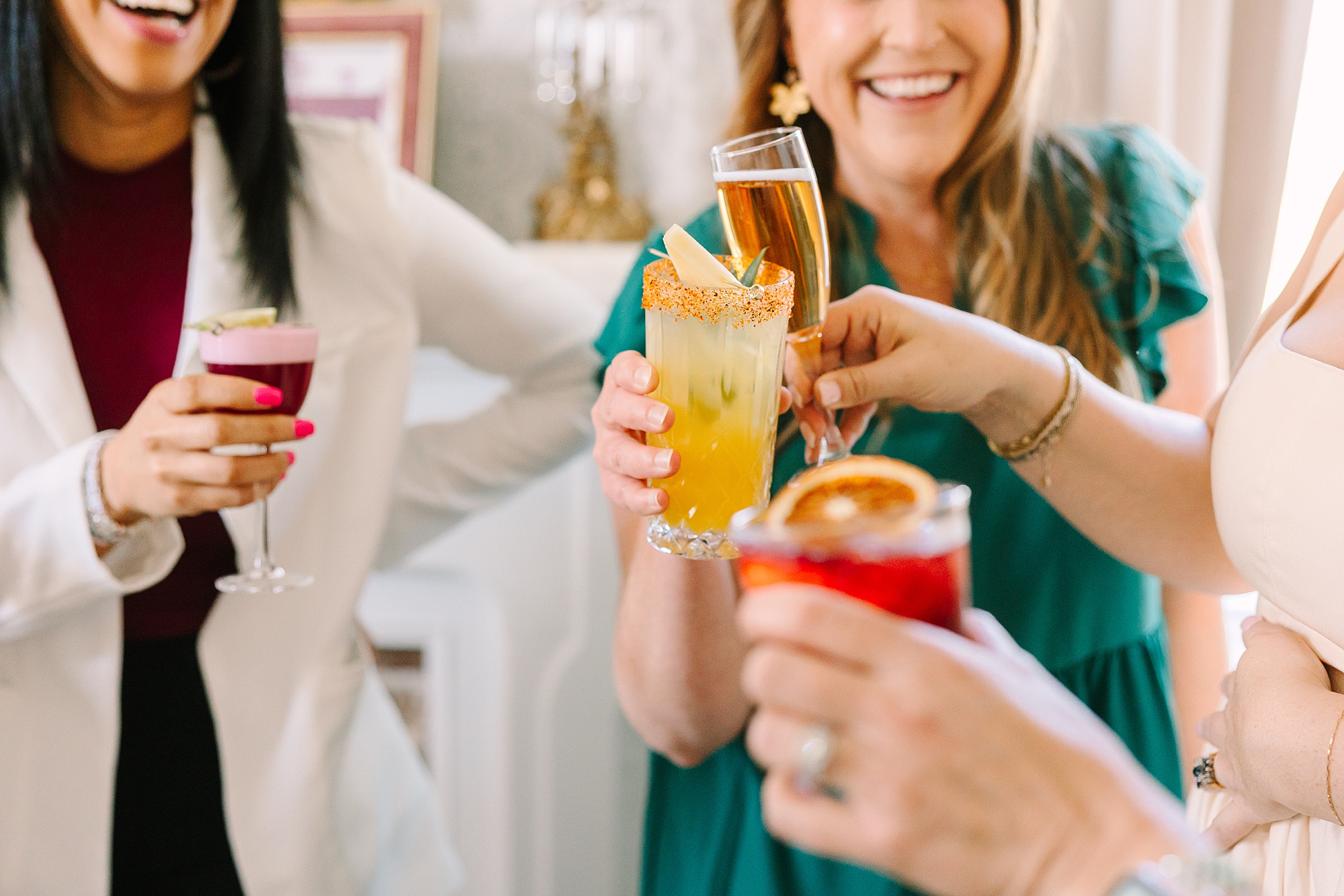 women toast custom cocktails during menu tasting at Magnolia Acres for Rose & Plum Living