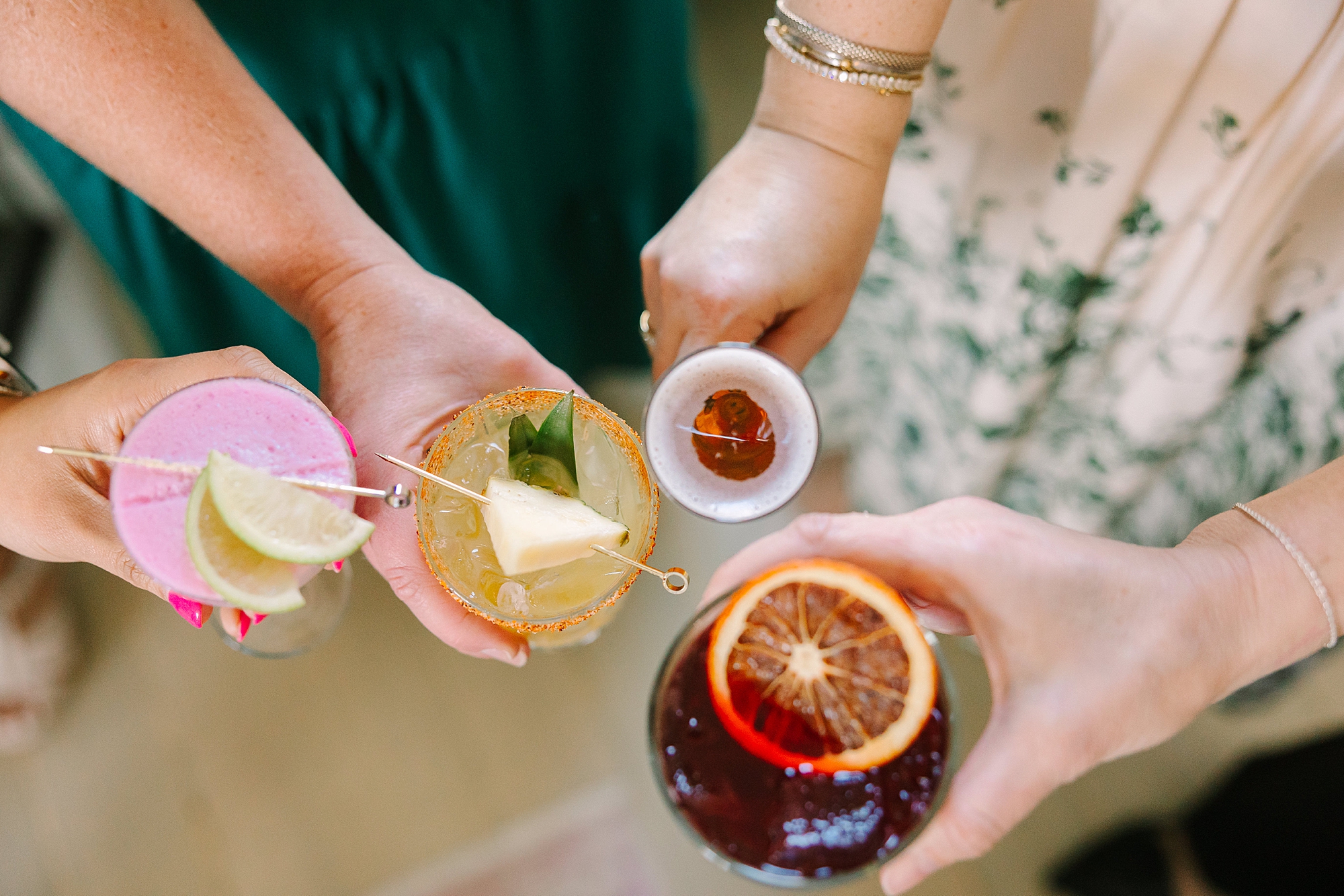 women hold out fruit cocktails during TN tasting event