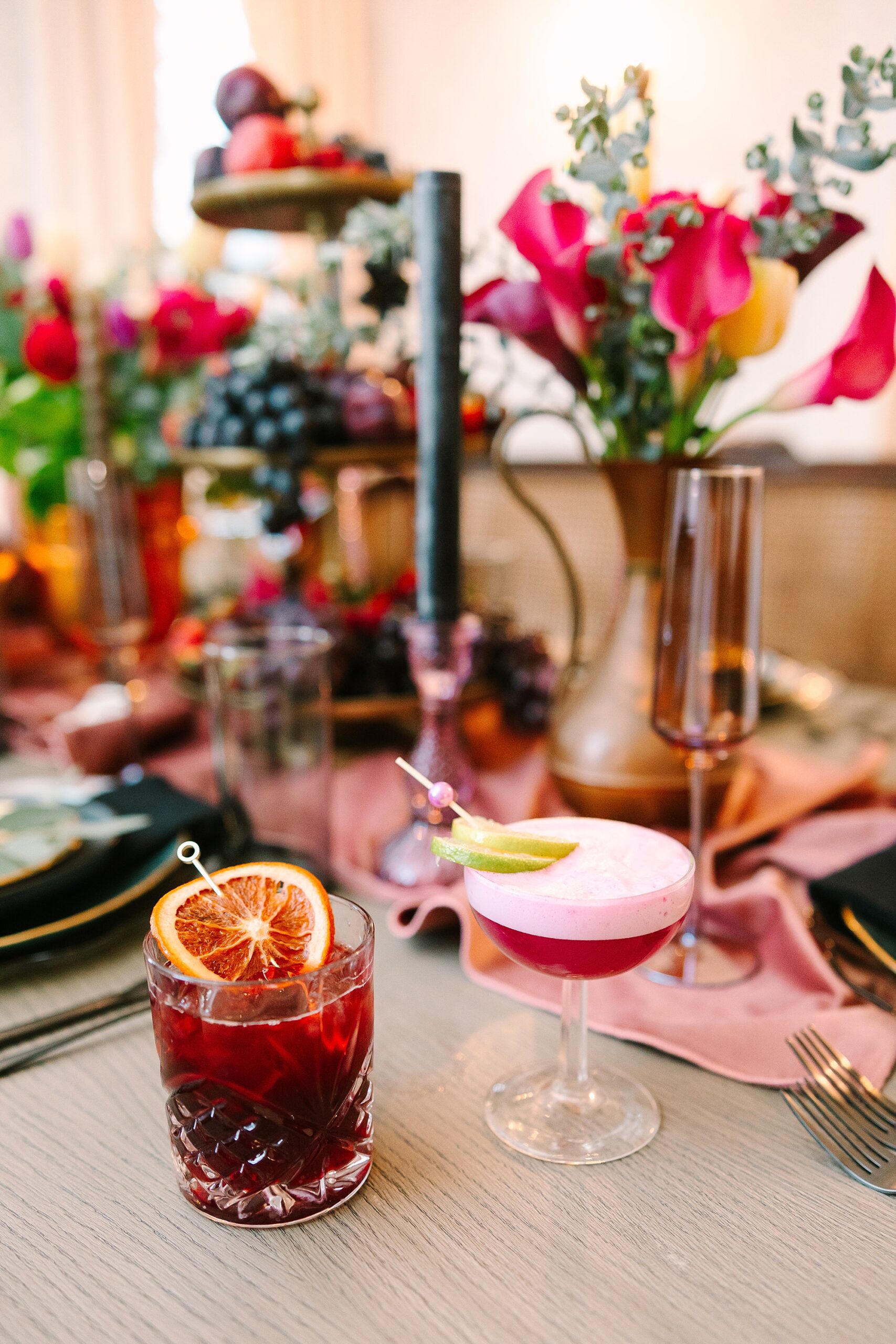 custom cocktail with table display featuring pink flowers and napkins