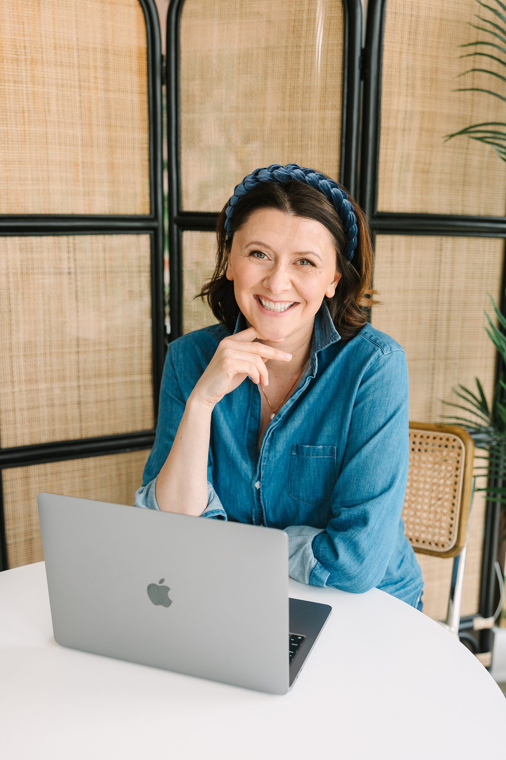 woman works on laptop during authentic branding session