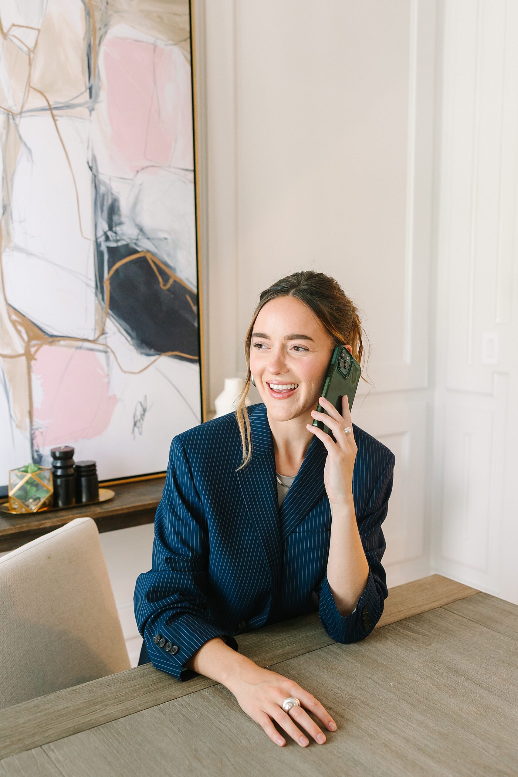 woman on phone in office during brand session