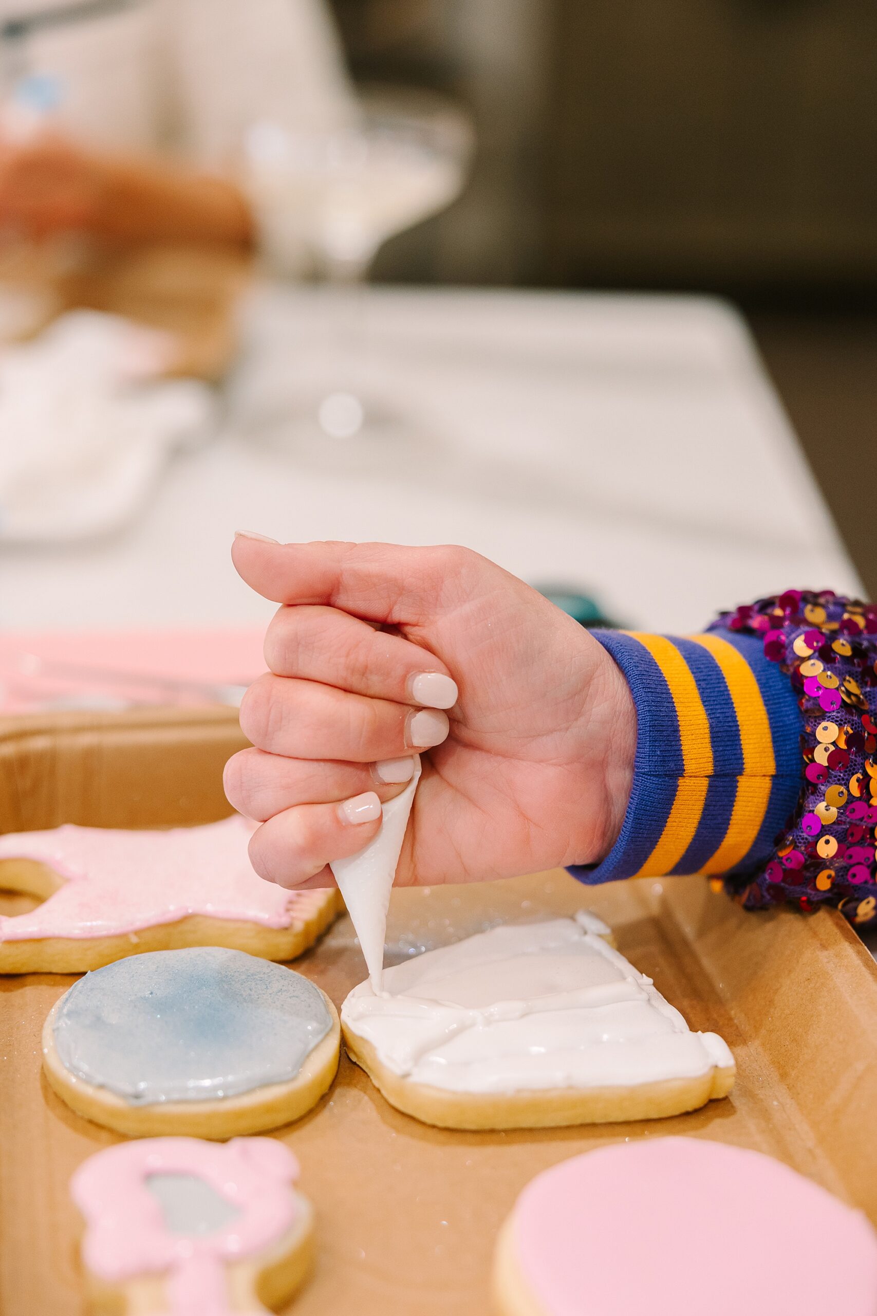 woman decorating cookies