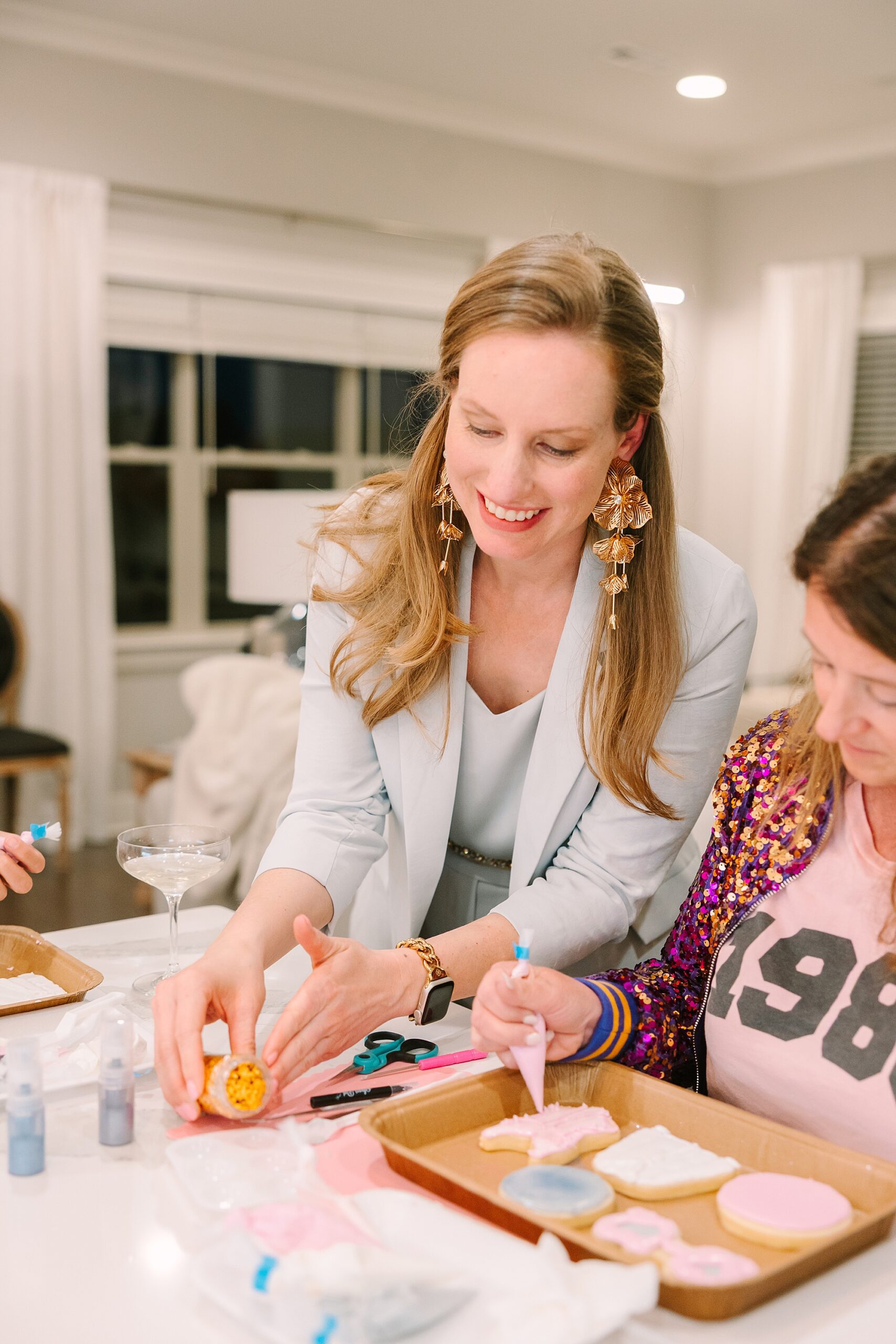 woman directing cookie decorating class